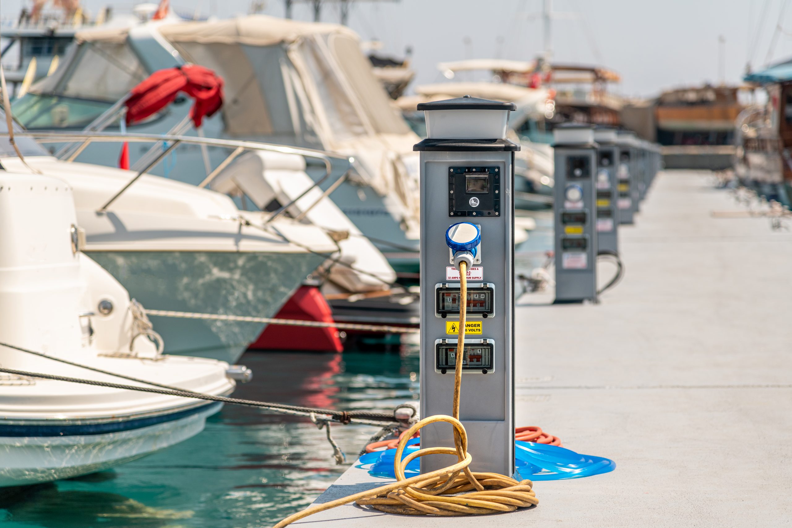 Marina manager using AI software dashboard for slip assignments and maintenance tracking.